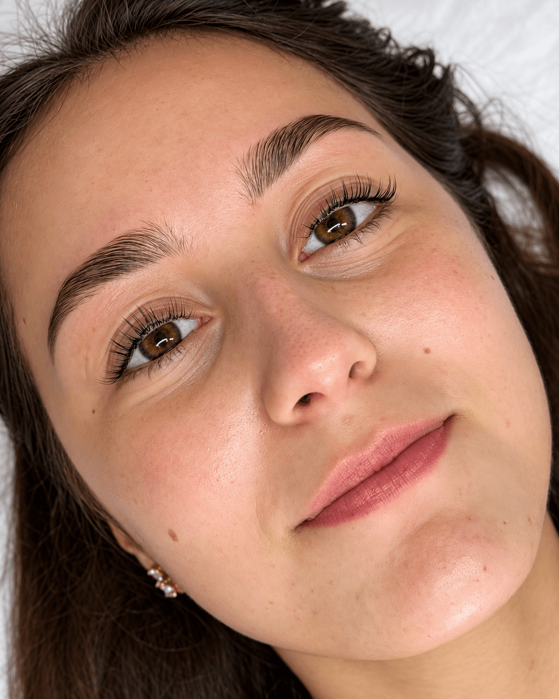 Close-up of lifted lashes and defined brows